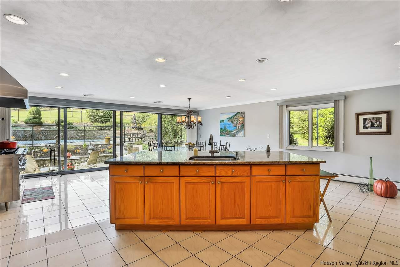 17 Deller Road Highland, NY 12528 - Photo 11 of 33 a large kitchen with kitchen island a sink and a large window