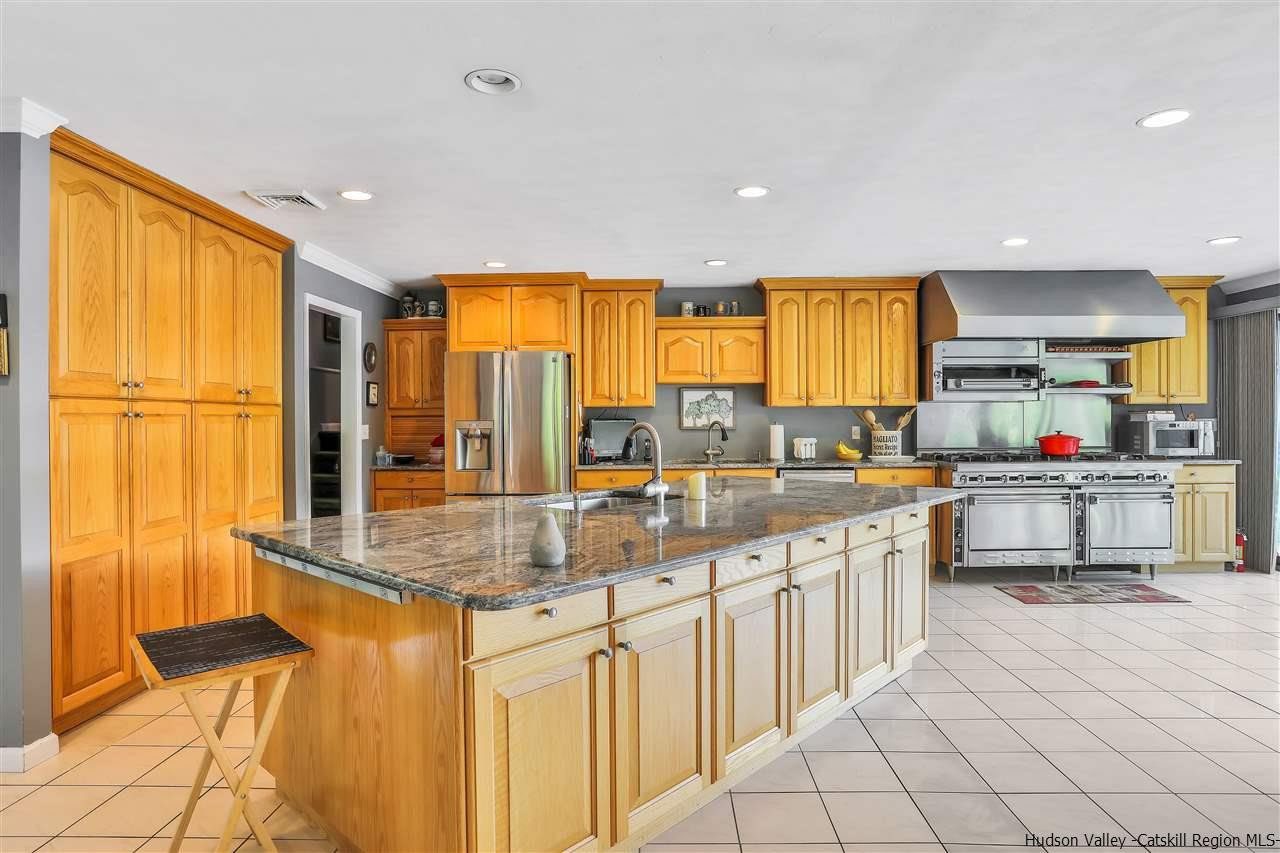 17 Deller Road Highland, NY 12528 - Photo 13 of 33 a kitchen with stainless steel appliances granite countertop a sink and cabinets