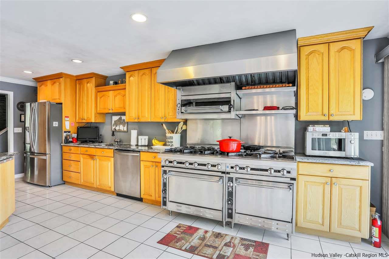 17 Deller Road Highland, NY 12528 - Photo 15 of 33 a kitchen with stainless steel appliances granite countertop a stove a sink and a refrigerator