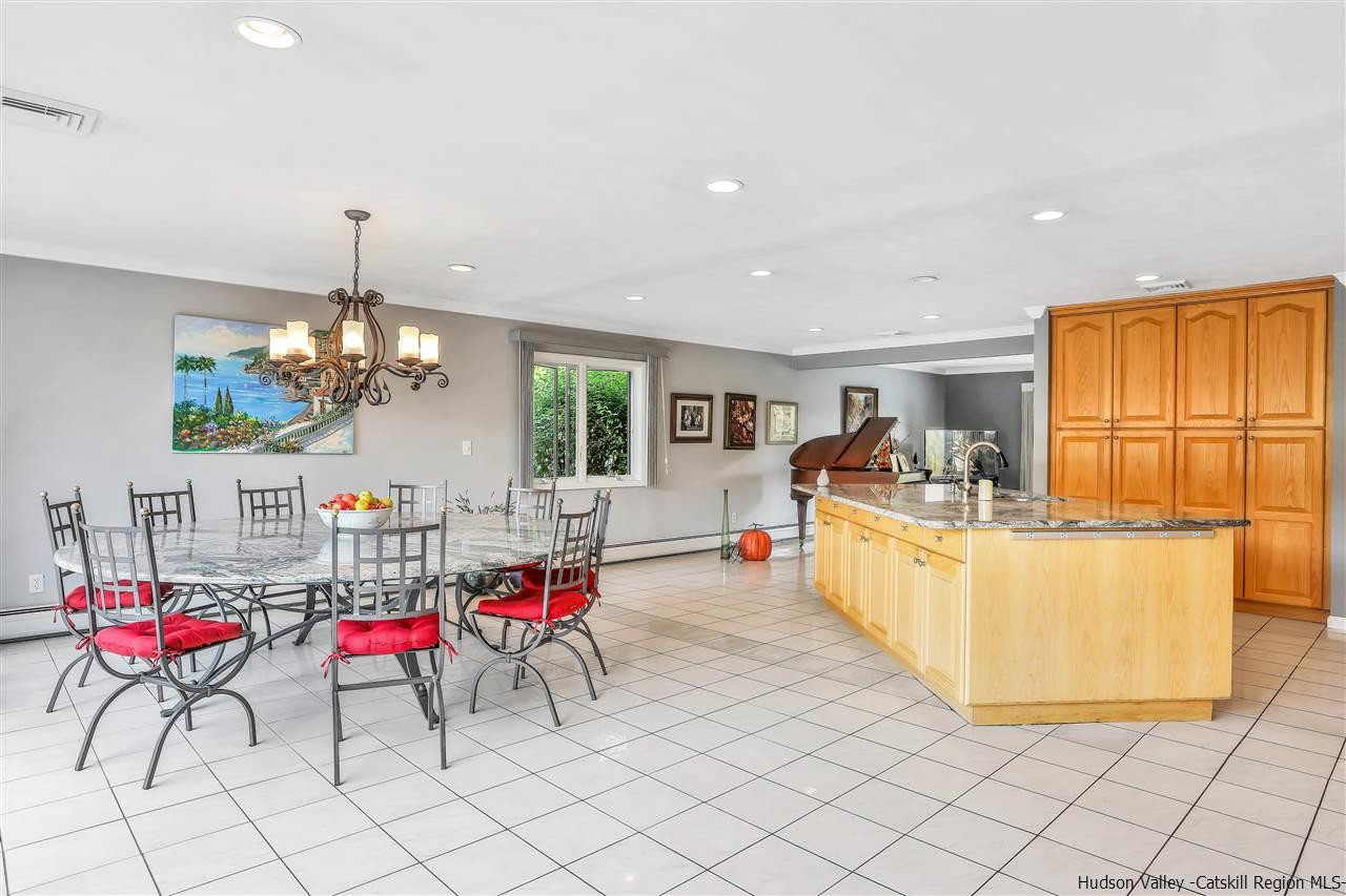 17 Deller Road Highland, NY 12528 - Photo 19 of 33 a living room with furniture a chandelier and a dining table