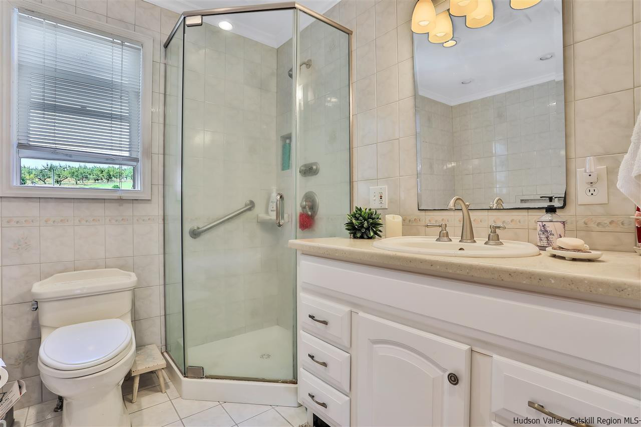 17 Deller Road Highland, NY 12528 - Photo 26 of 33 a bathroom with a granite countertop sink toilet and shower