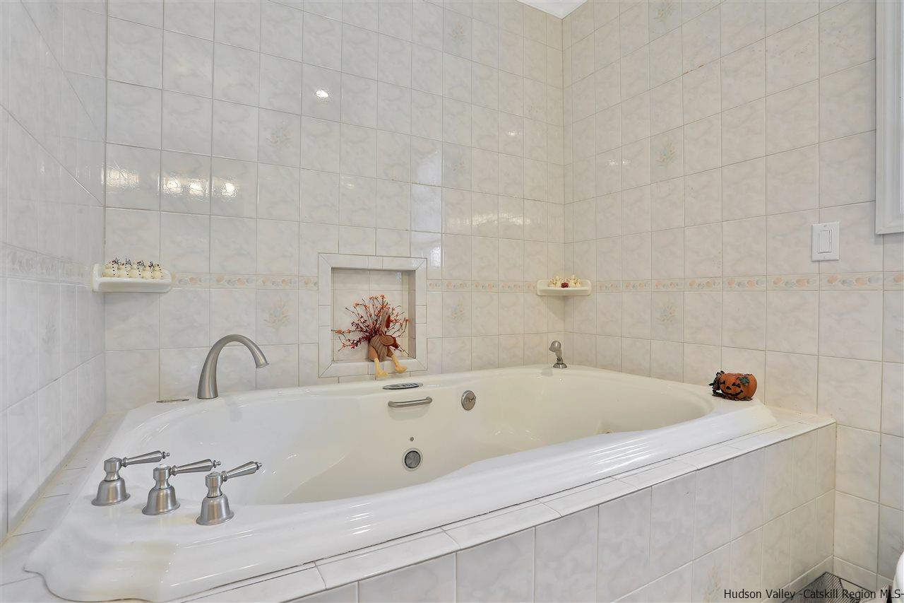 17 Deller Road Highland, NY 12528 - Photo 27 of 33 a bathroom with a tub and a sink