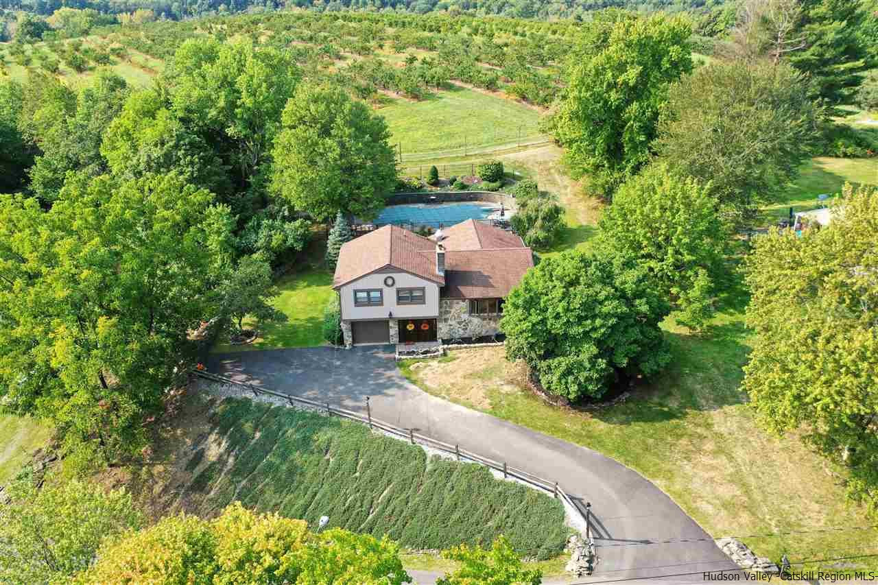 17 Deller Road Highland, NY 12528 - Photo 3 of 33 a view of a house with a small yard and large trees