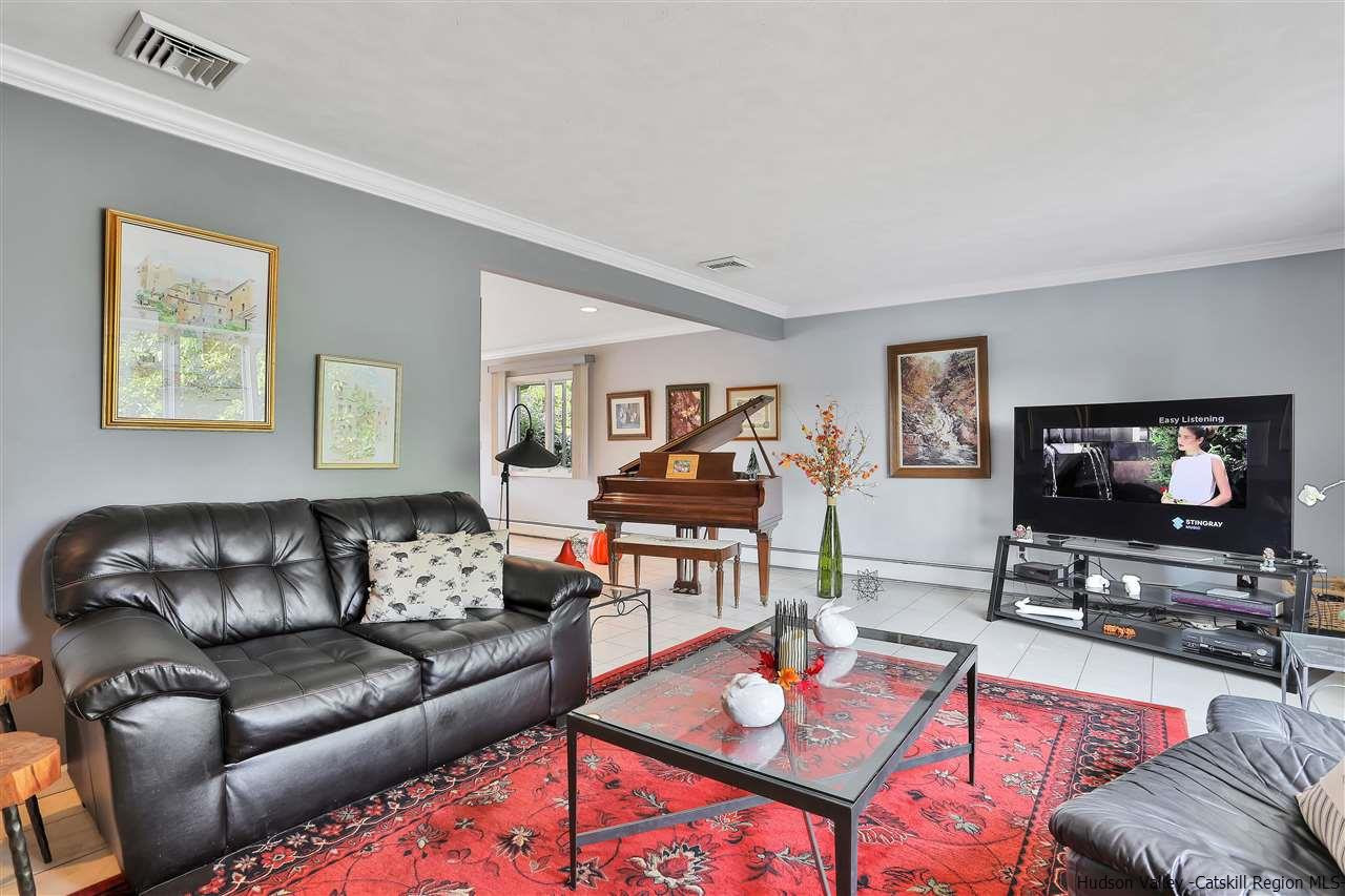 17 Deller Road Highland, NY 12528 - Photo 7 of 33 a living room with furniture and a flat screen tv