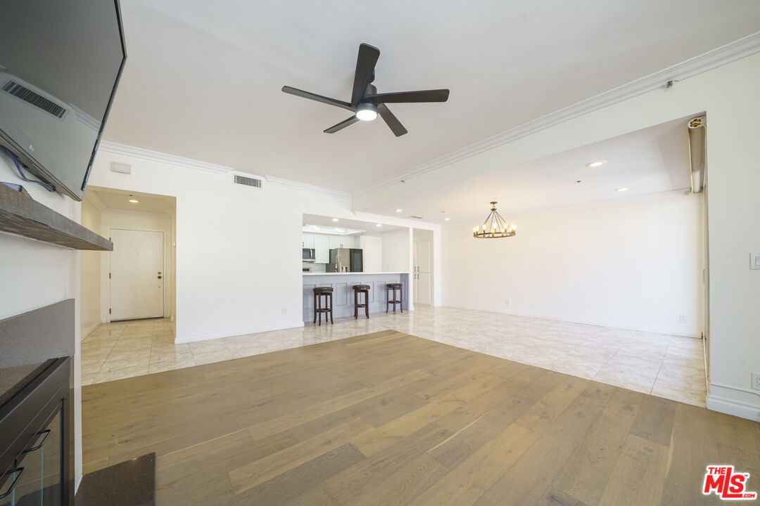 600 West 9th Street, Unit 1502 Los Angeles, CA 90015 - Photo 11 of 37 a view of livingroom with hardwood floor and a ceiling fan