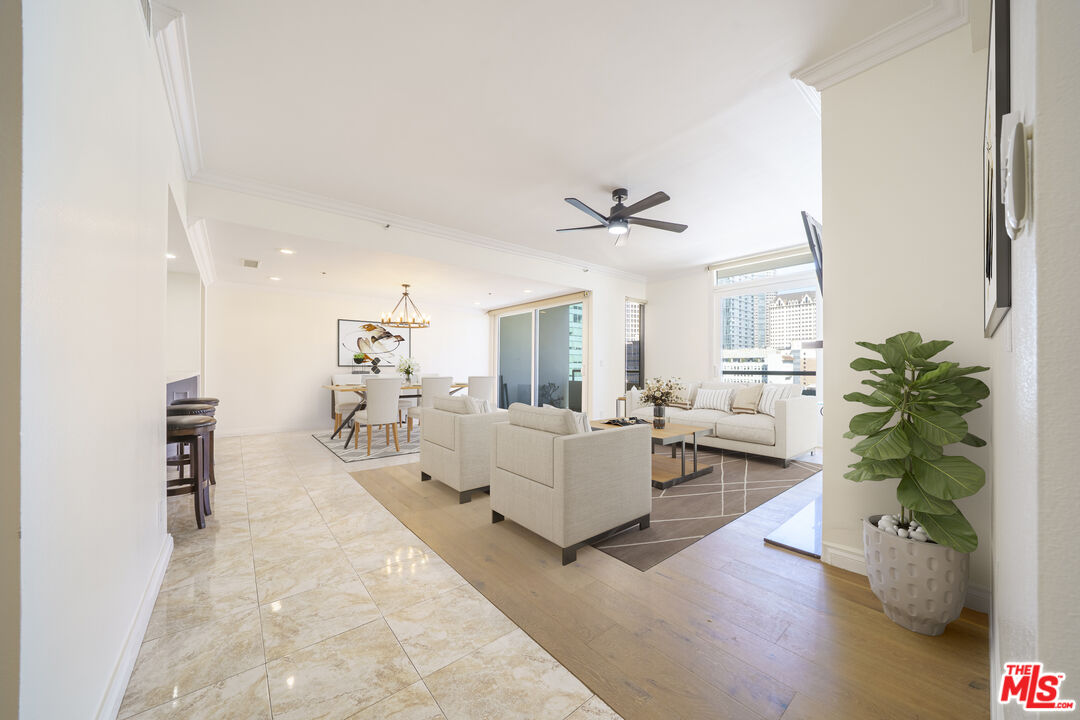 600 West 9th Street, Unit 1502 Los Angeles, CA 90015 - Photo 25 of 37 a living room with furniture and a potted plant