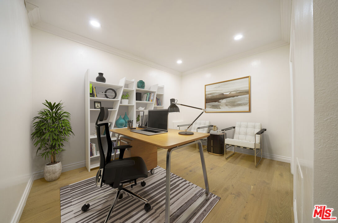 600 West 9th Street, Unit 1502 Los Angeles, CA 90015 - Photo 27 of 37 a living room with furniture and a potted plant