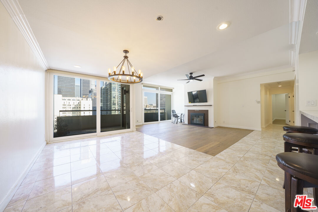600 West 9th Street, Unit 1502 Los Angeles, CA 90015 - Photo 9 of 37 a view of a kitchen with a sink and a living room
