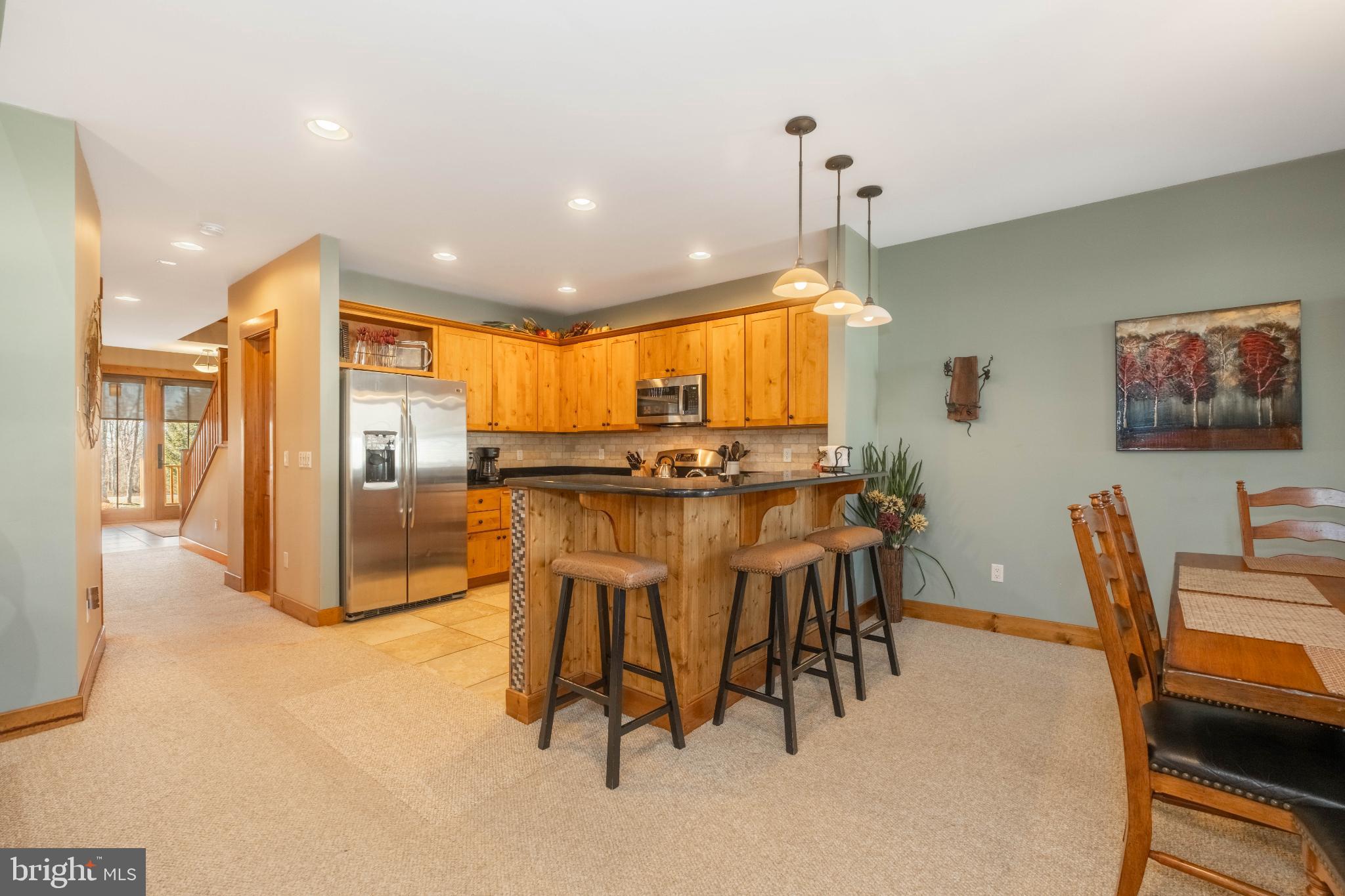 14 Ridge Run Road McHenry, MD 21541 - Photo 18 of 65 Warm wood tones in a cozy kitchen space.