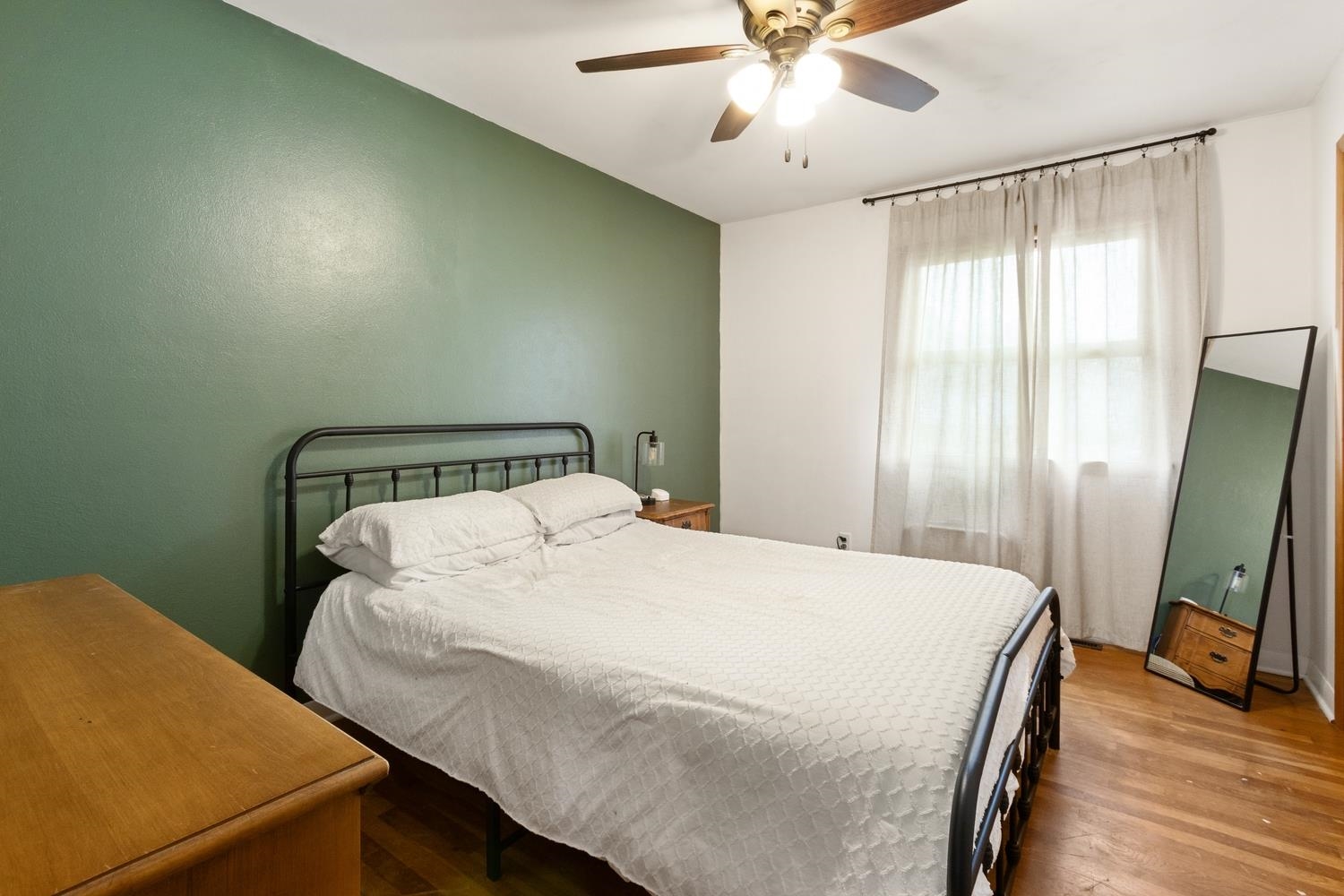 1202 East Le Fevre Road Sterling, IL 61081 - Photo 13 of 20 a bedroom with a bed and a flat screen tv