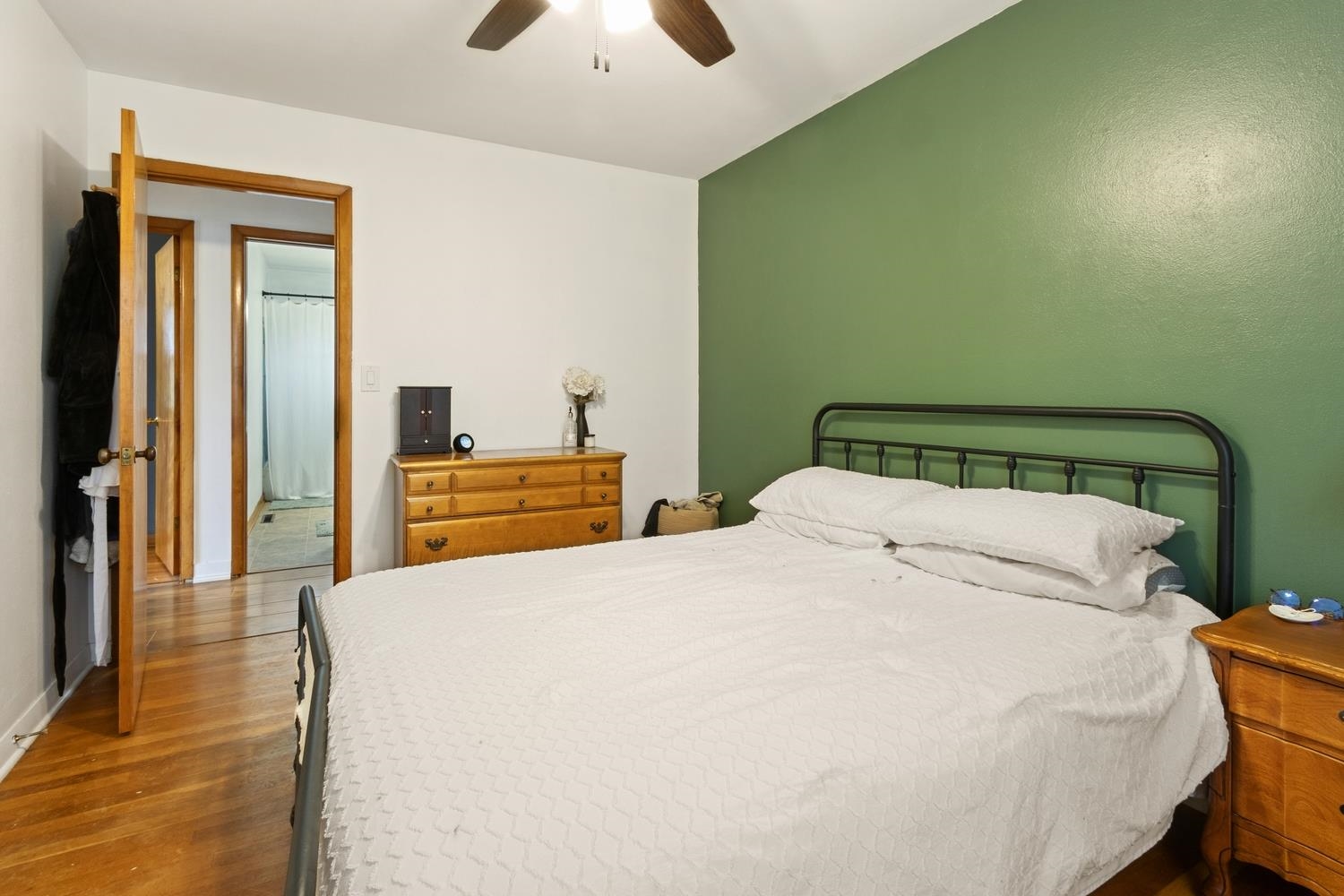 1202 East Le Fevre Road Sterling, IL 61081 - Photo 14 of 20 a bedroom with a bed and a chandelier