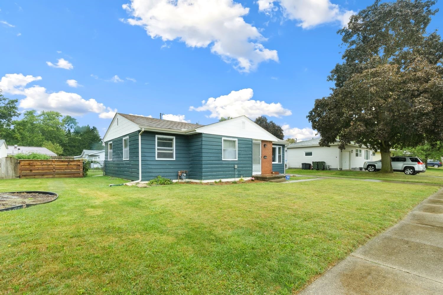 1202 East Le Fevre Road Sterling, IL 61081 - Photo 3 of 20 a front view of a house with a yard and trees