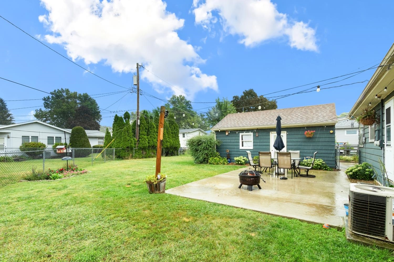 1202 East Le Fevre Road Sterling, IL 61081 - Photo 4 of 20 a view of a patio with a table and chairs under an umbrella