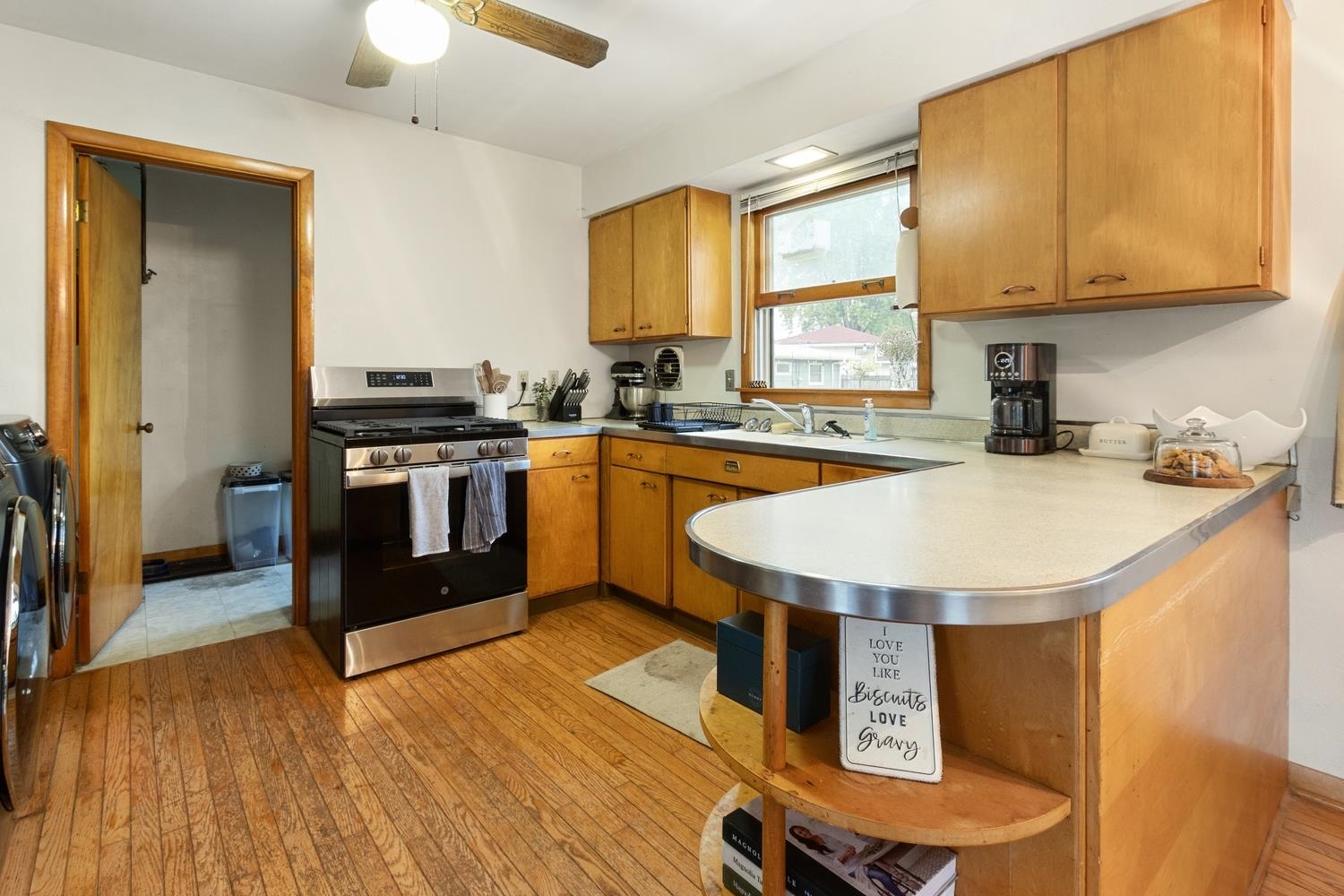 1202 East Le Fevre Road Sterling, IL 61081 - Photo 8 of 20 a kitchen with stainless steel appliances granite countertop a sink stove and refrigerator