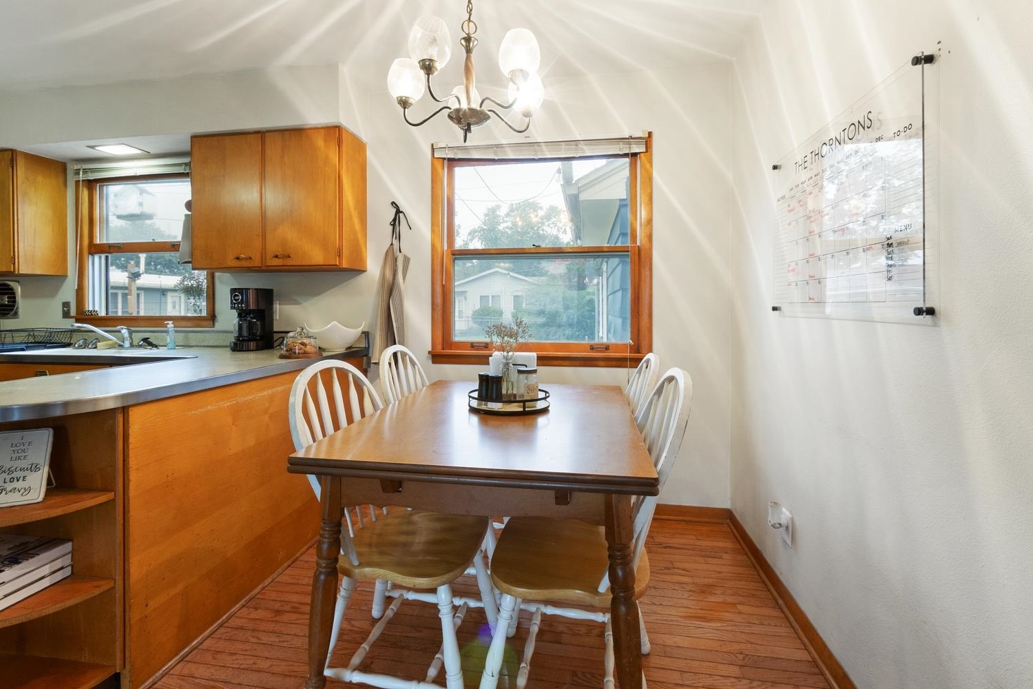 1202 East Le Fevre Road Sterling, IL 61081 - Photo 10 of 20 a view of a dining room with furniture window and wooden floor