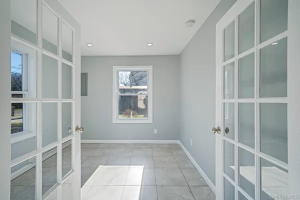 a view of entryway with room and front door