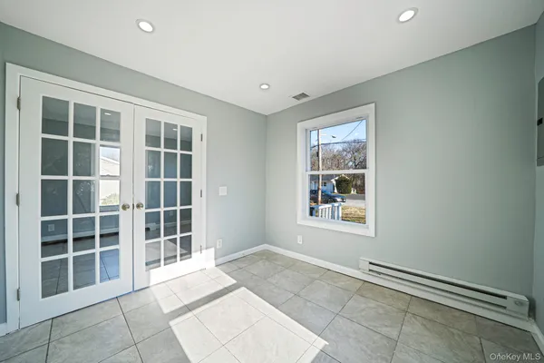 a view of an empty room with a window