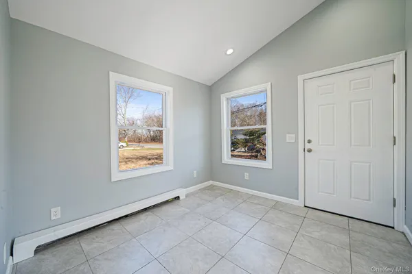 a view of an empty room with a window