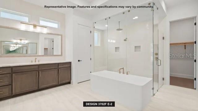 5476 Creek Ridge Road Brooksville, FL 34601 - Photo 11 of 21 a spacious bathroom with a shower sink double and mirror