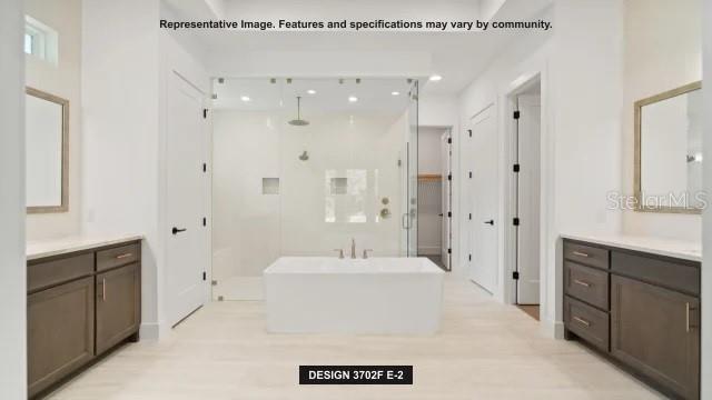 5476 Creek Ridge Road Brooksville, FL 34601 - Photo 12 of 21 a spacious bathroom with a sink a mirror and a shower