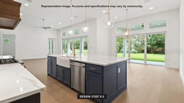 5476 Creek Ridge Road Brooksville, FL 34601 - Photo 3 of 21 a kitchen with a sink a counter top space and a large window