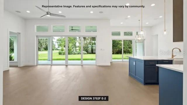 5476 Creek Ridge Road Brooksville, FL 34601 - Photo 5 of 21 a view of an empty room with a window and wooden floor