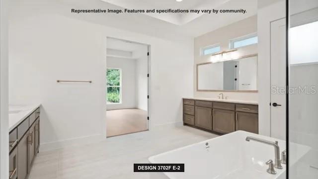 5476 Creek Ridge Road Brooksville, FL 34601 - Photo 10 of 21 a spacious bathroom with a tub sink and mirror