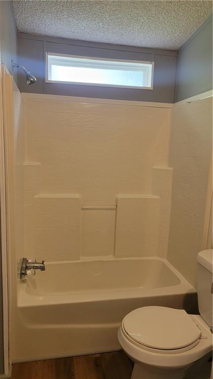 174 Luther Circle Villa Rica, GA 30180 - Photo 14 of 32 a bathroom with a toilet and a shower