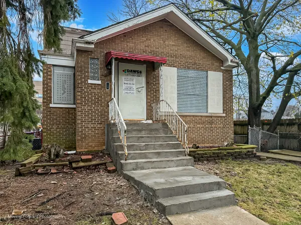 a front view of a house with stairs