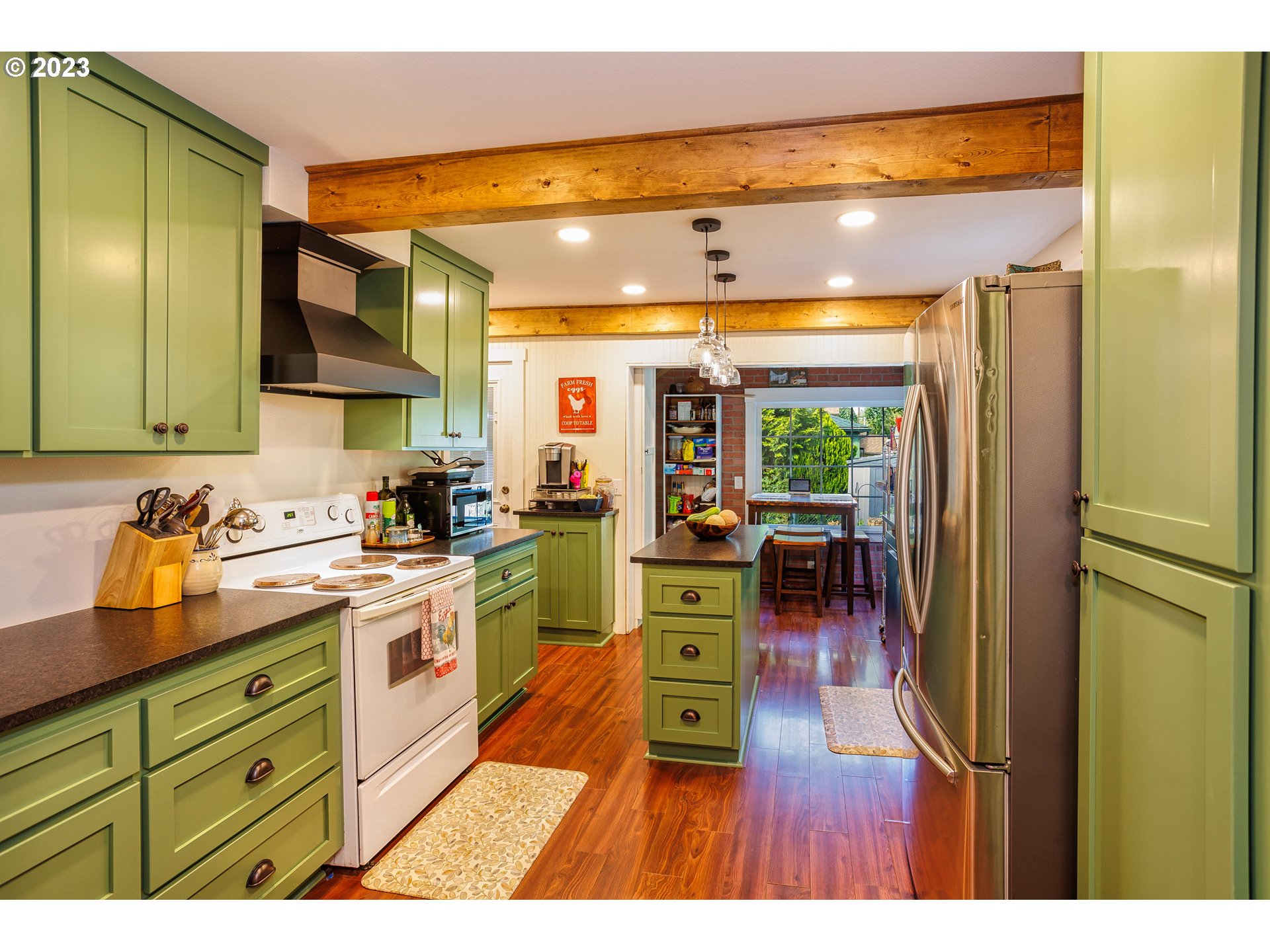 116 South 4th Avenue Ridgefield, WA 98642 - Photo 11 of 31 a kitchen with stainless steel appliances granite countertop a refrigerator and a sink