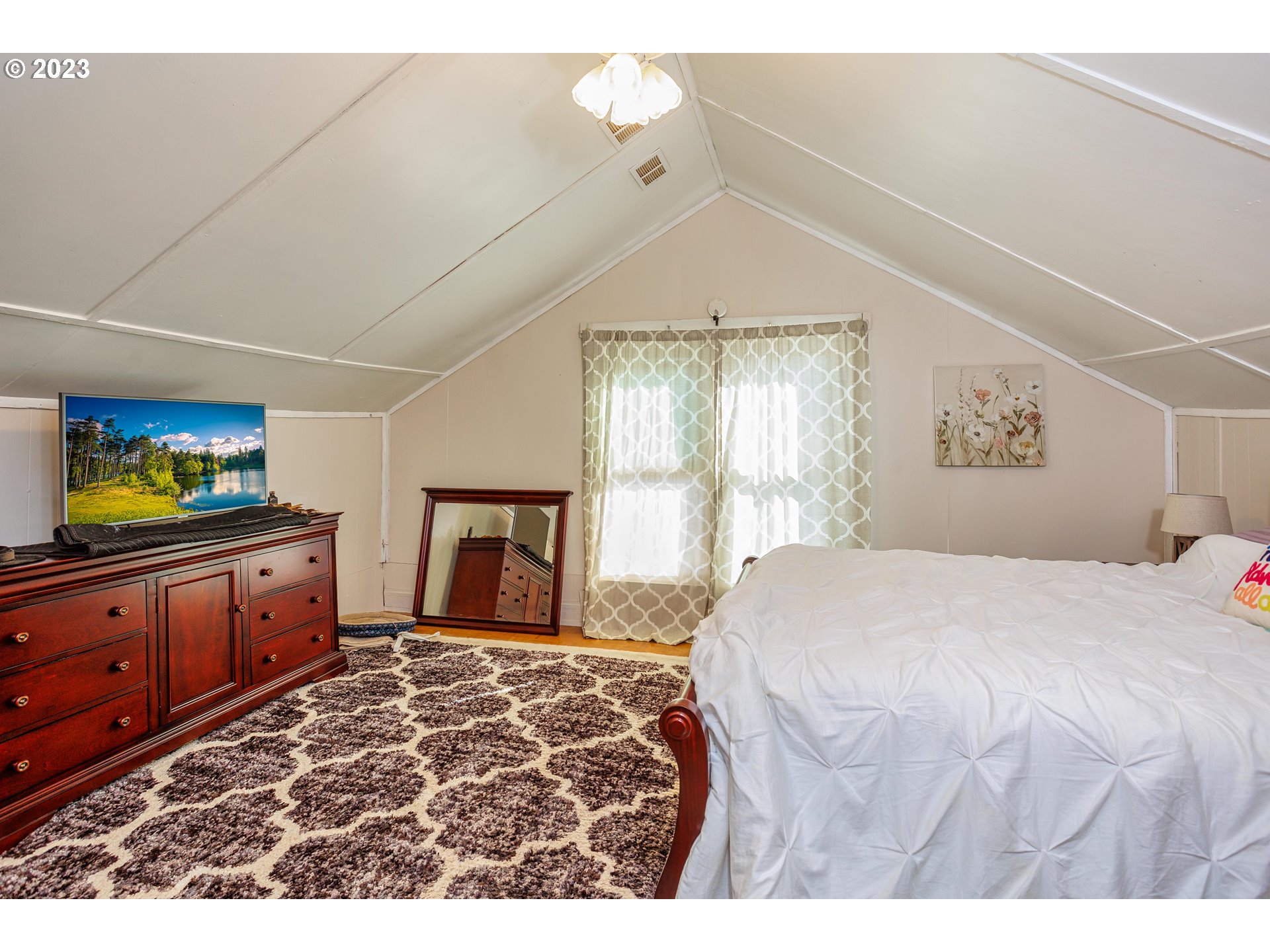 116 South 4th Avenue Ridgefield, WA 98642 - Photo 16 of 31 a bedroom with a bed and a dresser