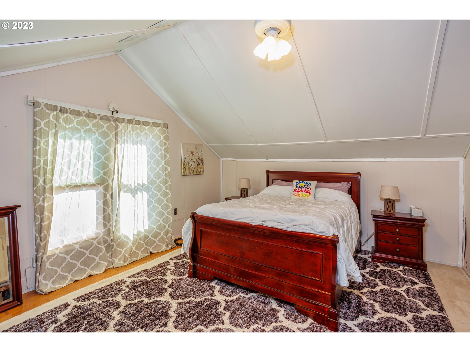 116 South 4th Avenue Ridgefield, WA 98642 - Photo 17 of 31 a bed sitting in a bedroom next to a window