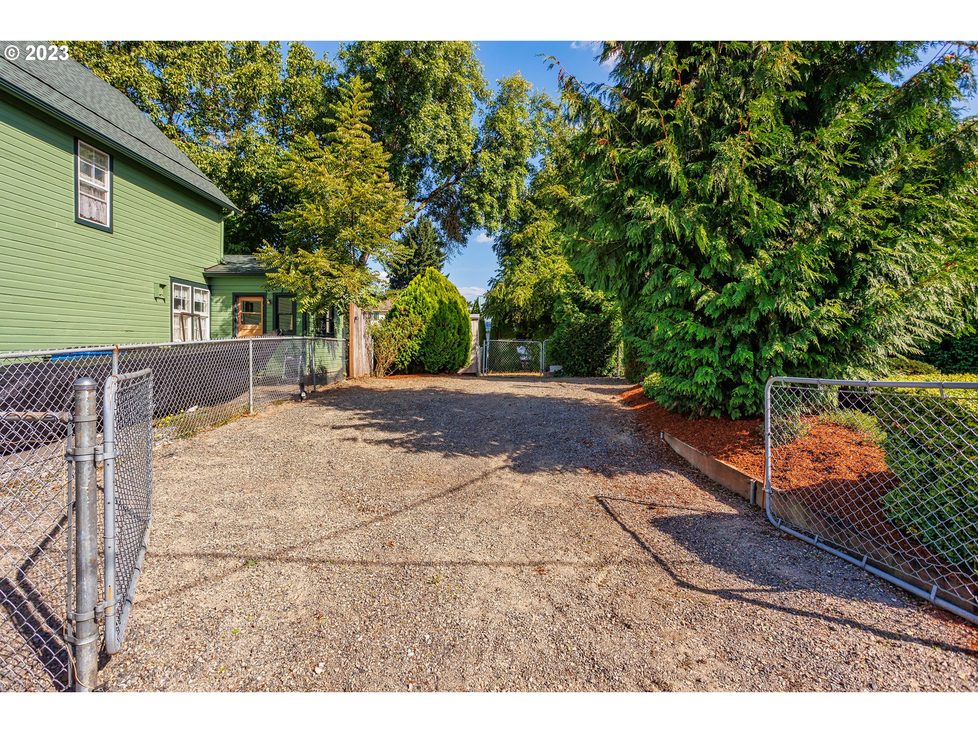 116 South 4th Avenue Ridgefield, WA 98642 - Photo 5 of 31 a view of a backyard with wooden fence