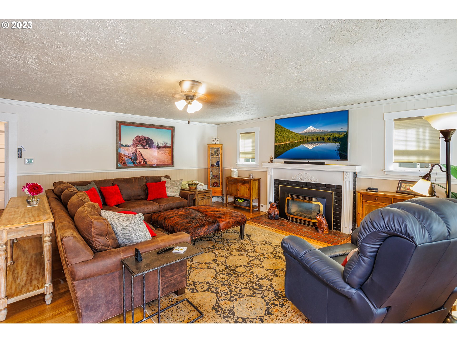 116 South 4th Avenue Ridgefield, WA 98642 - Photo 7 of 31 a living room with furniture and a fireplace