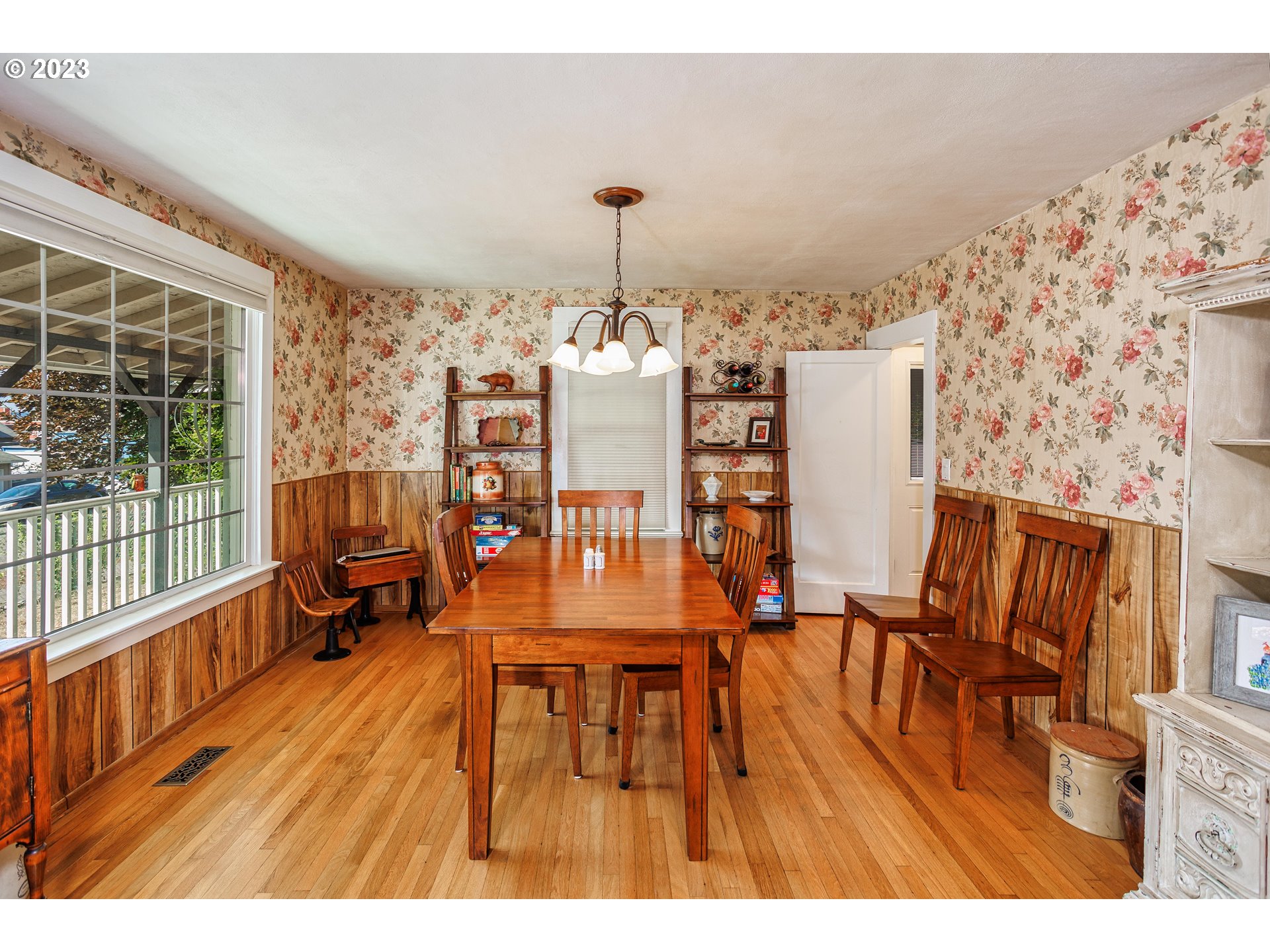 116 South 4th Avenue Ridgefield, WA 98642 - Photo 9 of 31 a dining room with furniture a chandelier and wooden floor