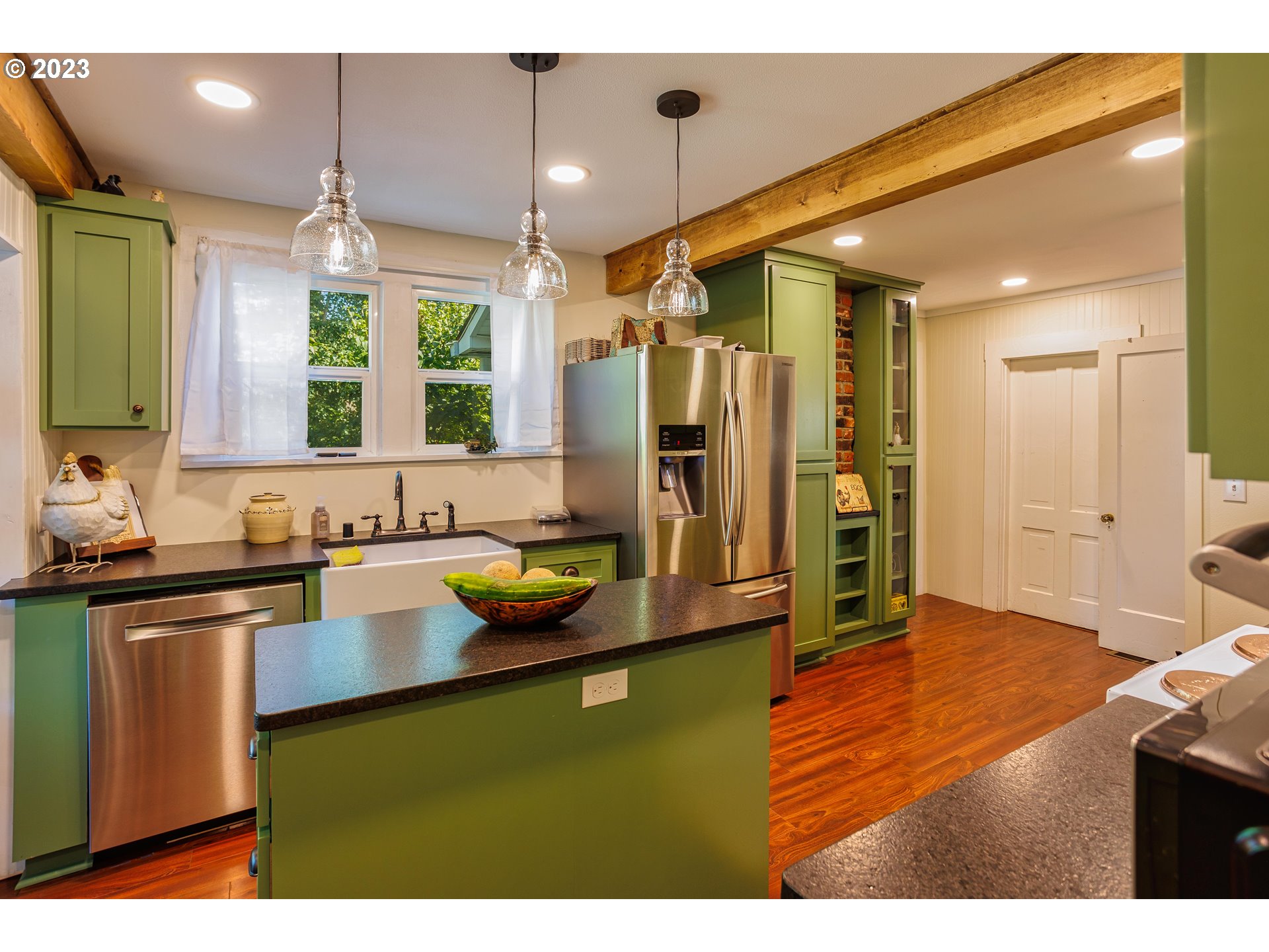116 South 4th Avenue Ridgefield, WA 98642 - Photo 10 of 31 a kitchen with a refrigerator and a sink
