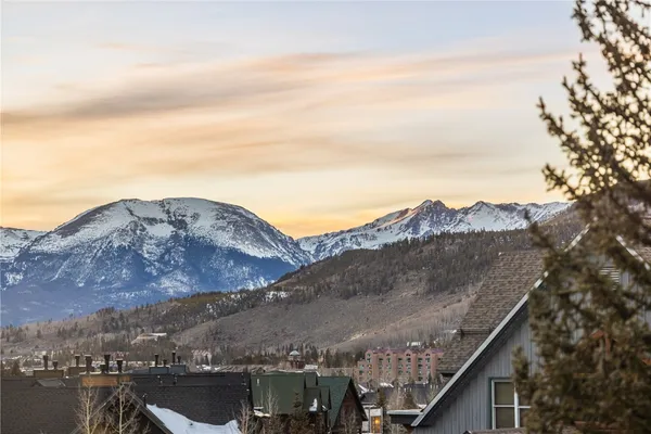 a view of a city with mountains in the background
