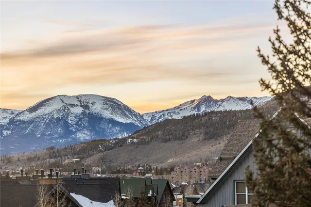 a view of a city with mountains in the background
