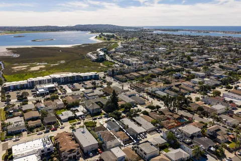 an aerial view of residential building with ocean view