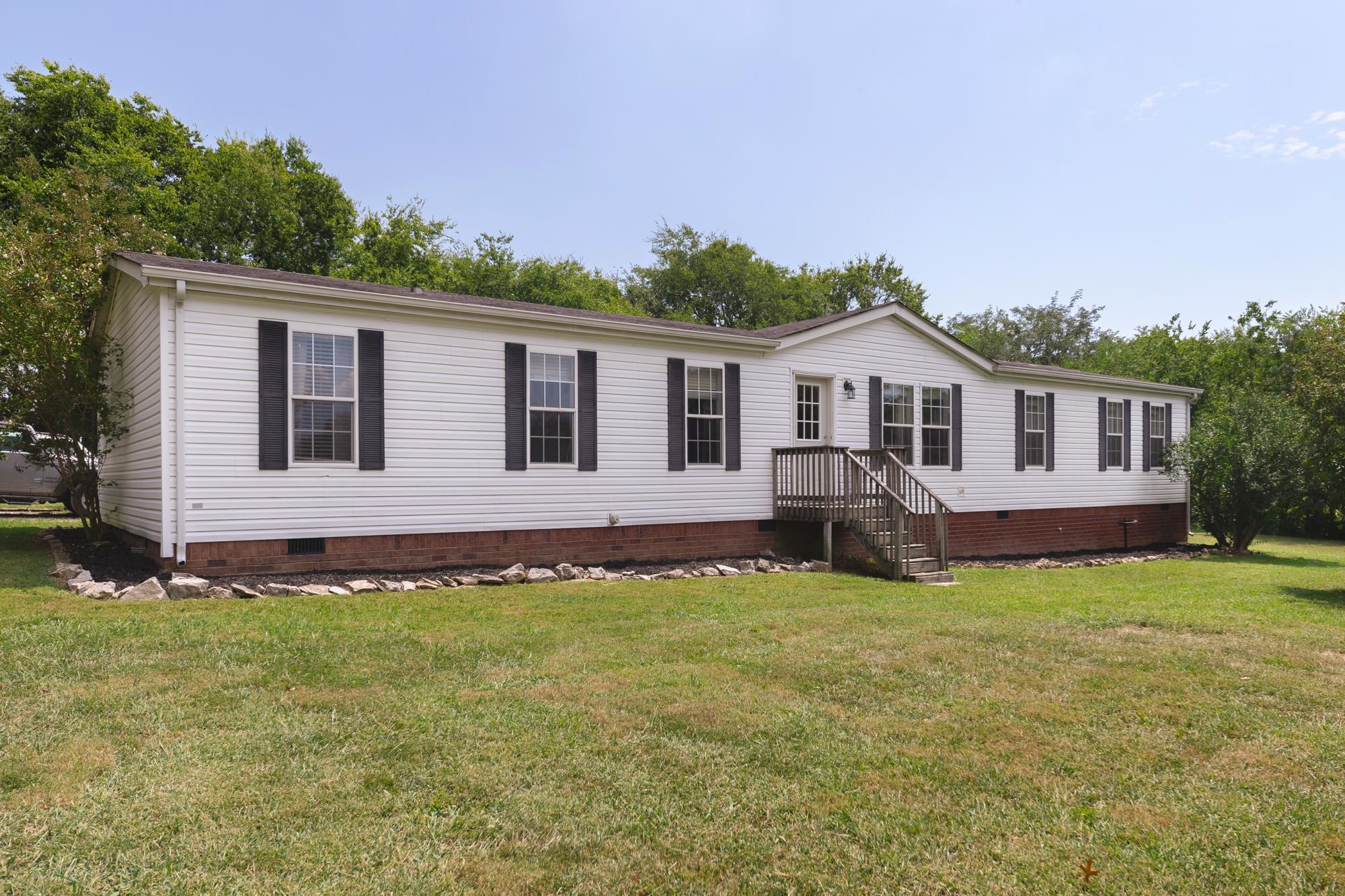 1232 Littleton Ranch Road Castalian Springs, TN 37031 - Photo 1 of 27 Incredibly spacious home on almost 5 acres. Lots of space inside and out. Brand new front door, and home is on a permanent foundation.