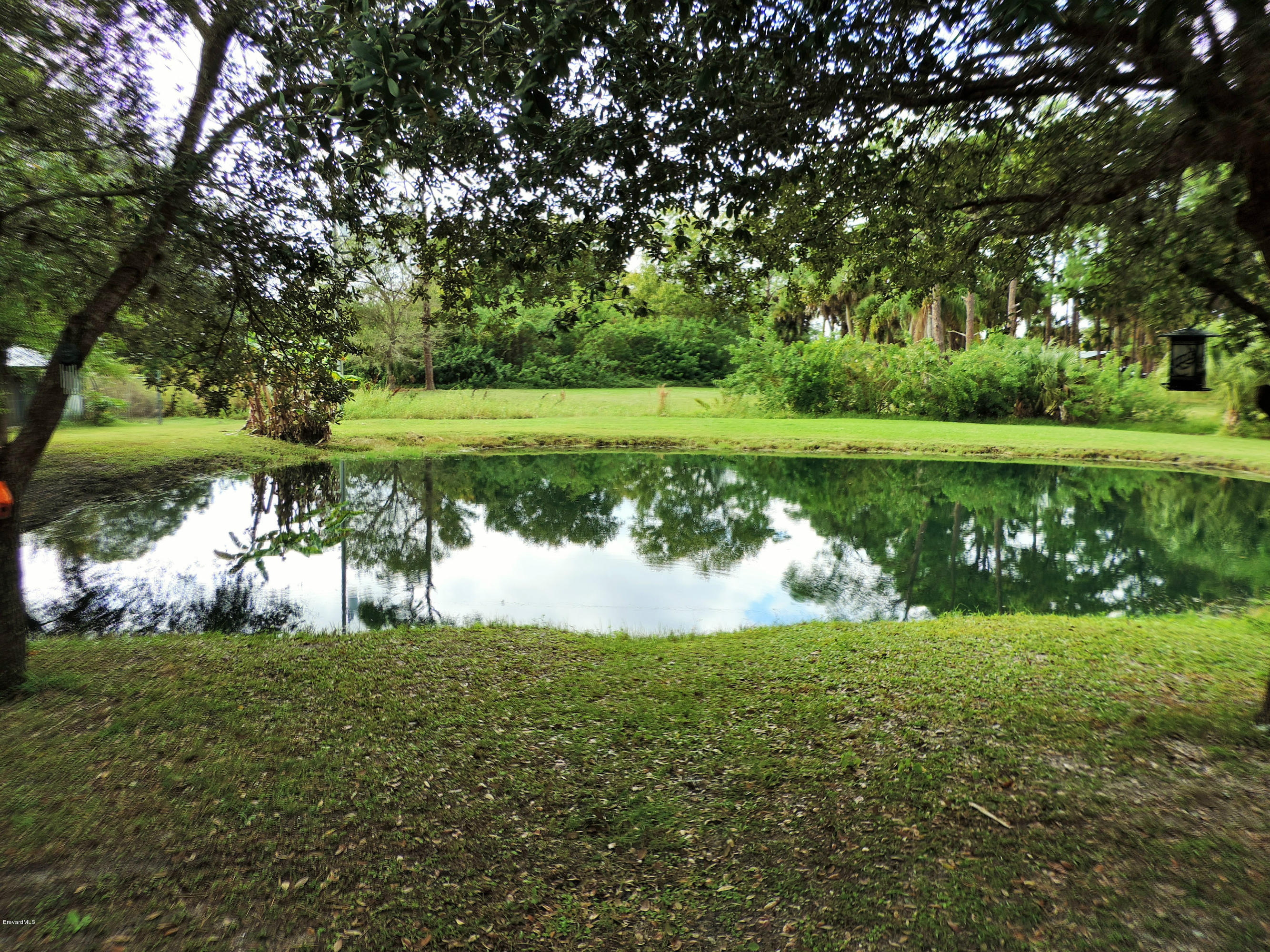 4240 Corey Road Grant Valkaria, FL 32950 - Photo 16 of 51 lake from patio