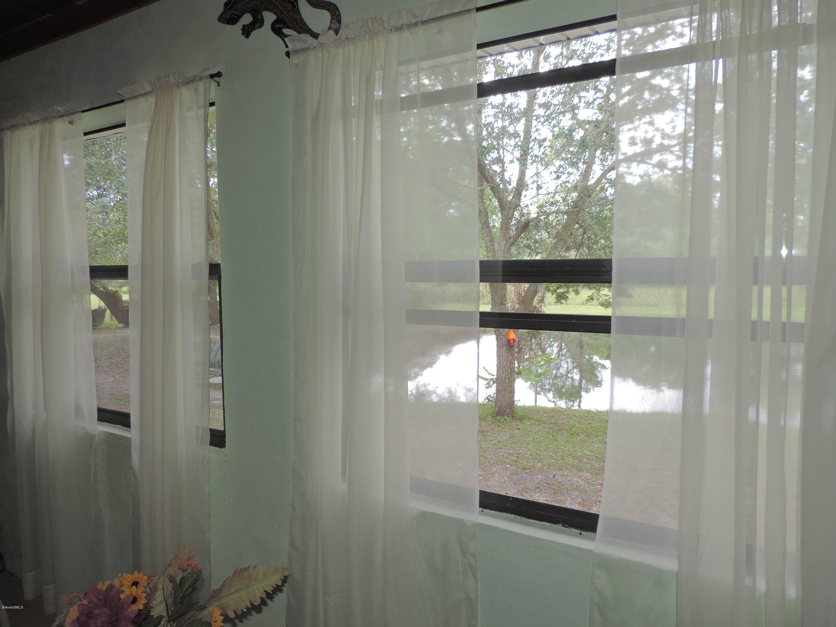 4240 Corey Road Grant Valkaria, FL 32950 - Photo 32 of 51 patio window view