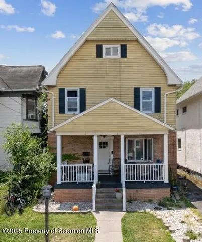 a front view of a house with a porch