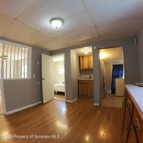 a view of a kitchen and an entryway