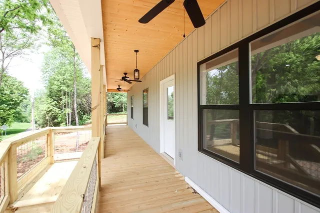 a view of a balcony with wooden floor