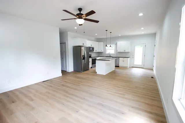 a view of a kitchen with a sink and cabinet
