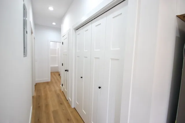 a view of a bathroom from the hallway