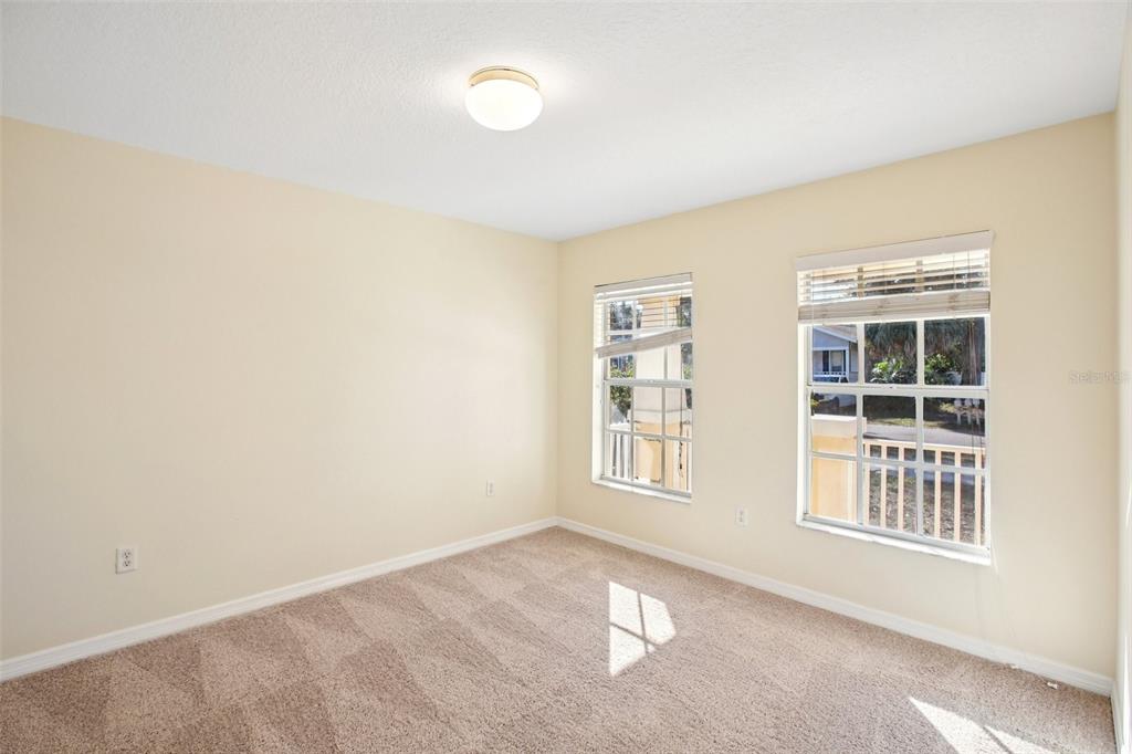 2719 West Union Street Tampa, FL 33607 - Photo 12 of 27 an empty room with windows