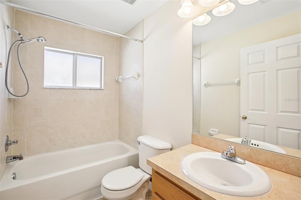 2719 West Union Street Tampa, FL 33607 - Photo 13 of 27 a bathroom with a sink a toilet and shower