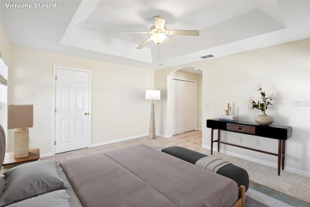2719 West Union Street Tampa, FL 33607 - Photo 16 of 27 a bedroom with a bed and a chandelier